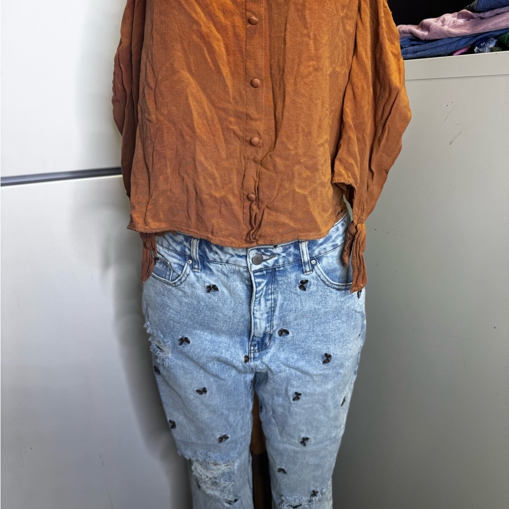 Rust Button-Up Blouse and Distressed Jeans
